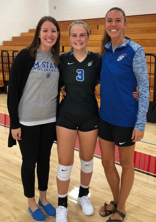 Sydney Hovland (center) celebrates 1,000 assists with coaches Abby Crowser (right) and Krista Shaikoski (left).